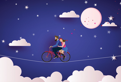 Paar auf einem Fahrrad bei Nacht